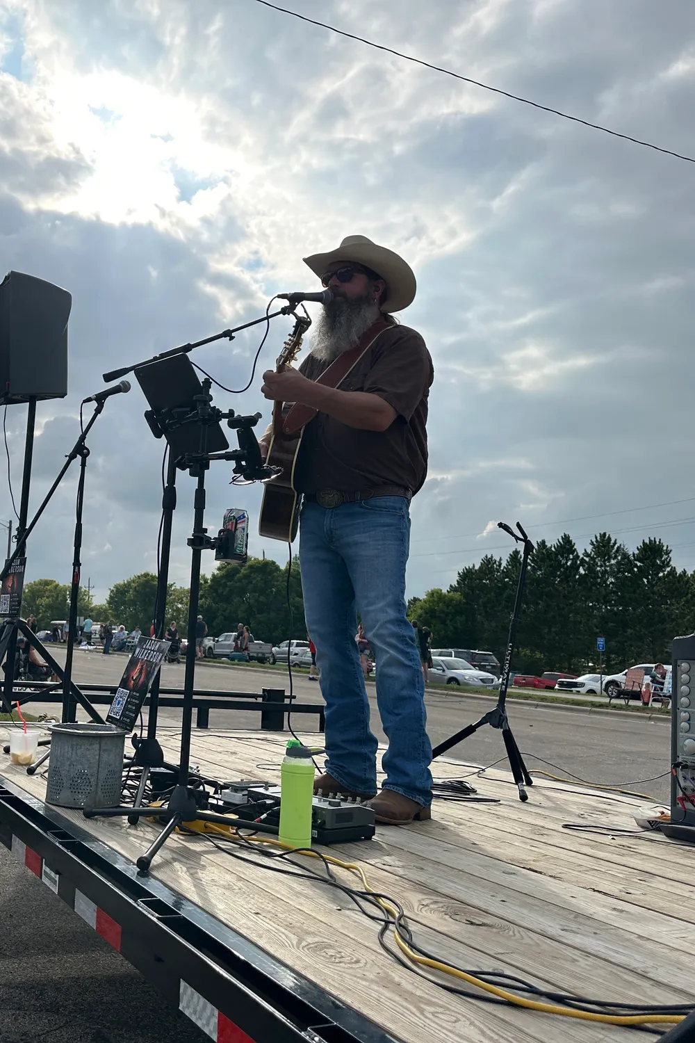 Jason Wilkerson performing live on an outdoor stage